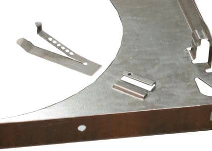 linear clip insert in plaster frame to retain aluminum reflectors